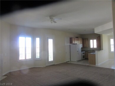 View from living room into kitchen and dining room