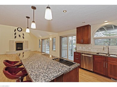 The breakfast bar features pendant lighting, moder