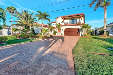Mediterranean / spanish-style home with a front la