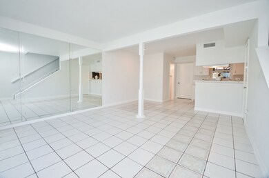Beautiful white tile flooring extends throughout t