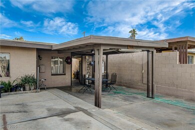 View of patio with outdoor dining area and fence