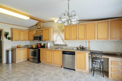Kitchen with Desk area and Patio Door to Deck