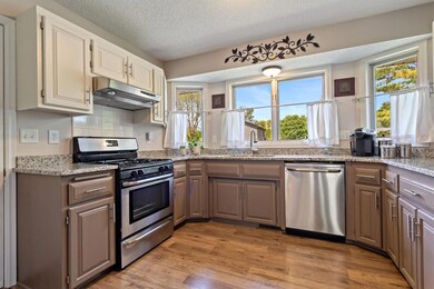 full wall of windows in the kitchen really lets the sunshine in!