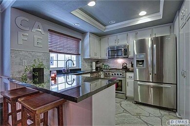 BEAUTIFUL KITCHEN W / BAR SEATING.