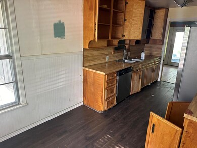 Kitchen featuring plenty of natural light, sink, a