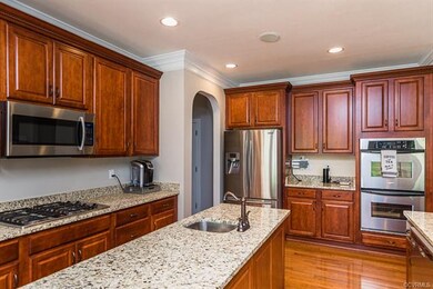 Enormous kitchen opens into nook and second family