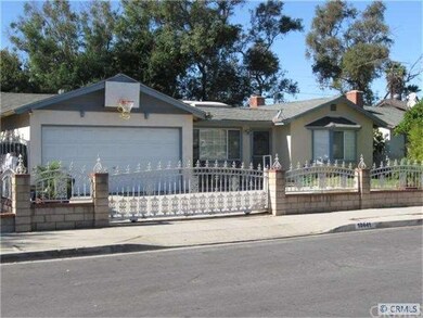 A sliding gate across the driveway provides securi