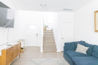 Living area featuring light wood-style flooring a
