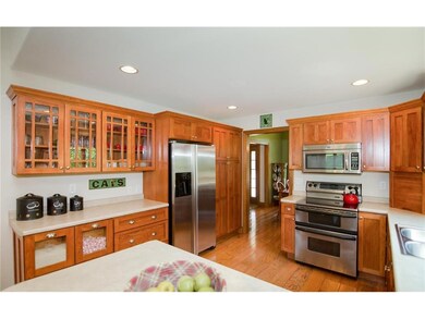 Kitchen with stainless appliances and oak flooring