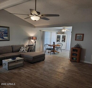 living room area leading to kitchen