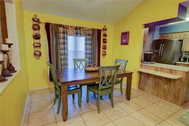 Kitchen with kitchen bar.  The left of the photo, 