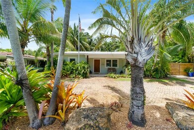 Lush tropical landscaping and Chicago brick paver driveway lead you to the charming Key West Style home that has been completely updated.