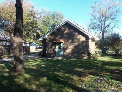 View of home's exterior with a yard