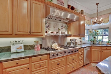 Gas cooktop with vent hood.