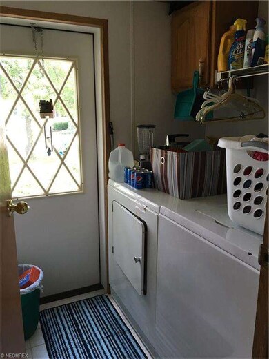 Walk in from the back door. Washer and Dryer stay.