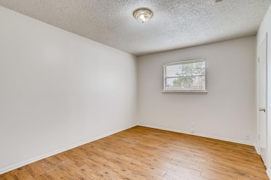 Spare room featuring light wood-style floors and 