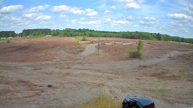 View of wooded area featuring a rural view