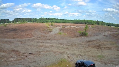 View of wooded area featuring a rural view
