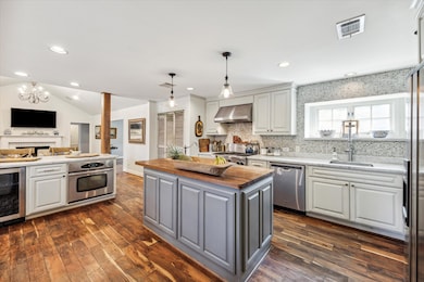 The well-appointed kitchen, featuring a central is