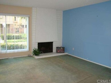 Living room has fireplace and greenbelt view