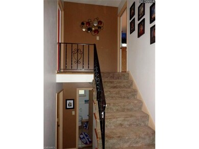 The split stairway goes up to 2 bedrooms and a bat