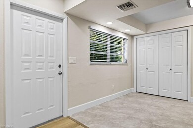 front entry with kitchen to right, dining and grea