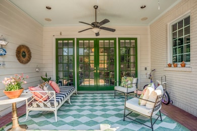 Step outside through classic French doors to a bac