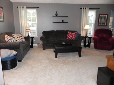 Great Room with custom blinds lots of natural ligh