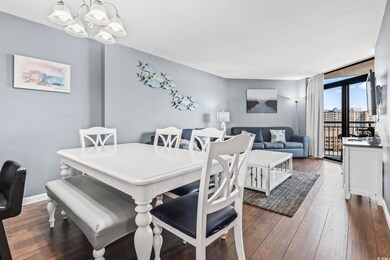 Dining area with dark hardwood / wood-style floors