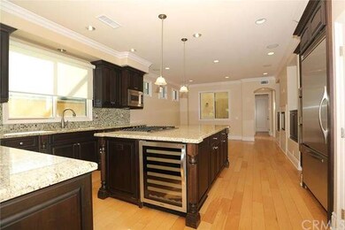 Kitchen w/ large center island, wine refrigerator,