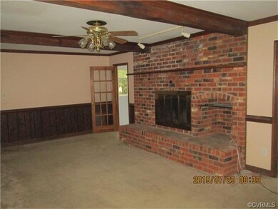 Family room with wood burning fireplace