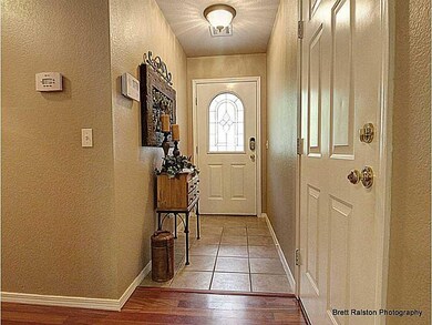 Other. Entry with ceramic tile floor leads you into spacious, open living area and kitchen