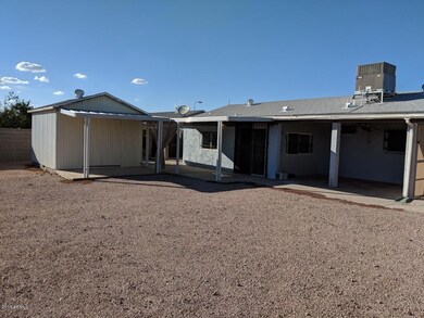 BAck of home with 3 patio areas