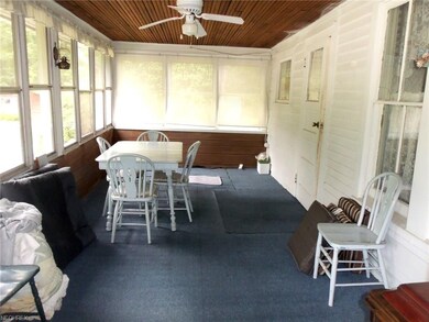 Enclosed side porch off kitchen would be a great p