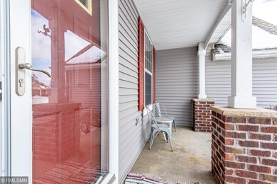 Entry has a charming concrete front porch.