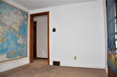 Dining room, one door leads to the kitchen and the