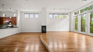 Spacious living room set apart by a stylish step-d