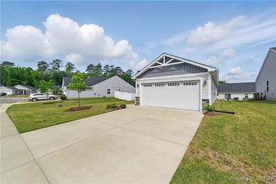 View of front of property featuring stone siding,
