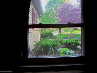 view from family room to the gorgeous landscaping and pleasant neighborhood streets