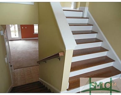 Foyer. 2-Story entry foyer with stairs to upper, m