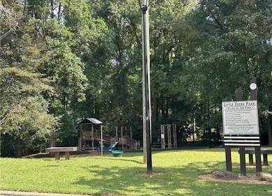 View of community featuring a lawn