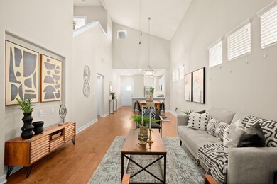 Living room featuring light wood-type flooring, h