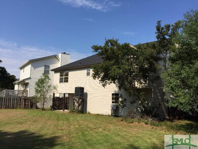 Rear View of  House, backyard, and covered patio