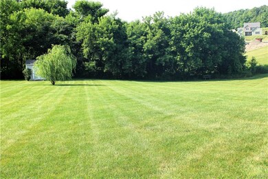 1 acre lot with a giant, flat back yard!  The shed