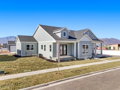 Modern farmhouse style home featuring a mountain view, covered porch, and board and batten siding
