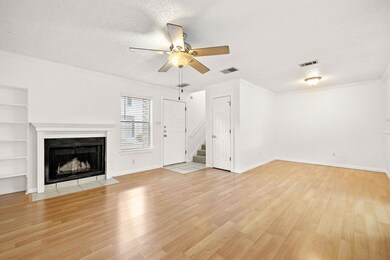 Unfurnished living room with crown molding, a tex