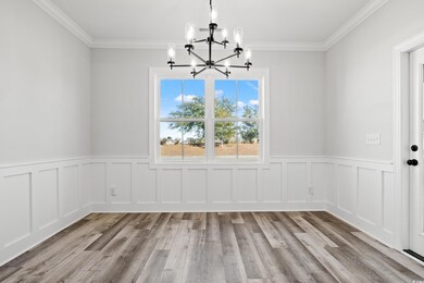 Unfurnished dining area with ornamental molding, l