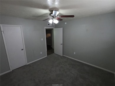 Unfurnished bedroom with visible vents, carpet flo