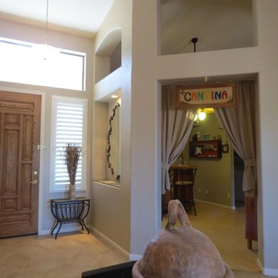 VIEW FROM DINING ROOM TO ENTRY & BAR/DEN