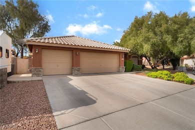 View of front of home featuring driveway, stone si